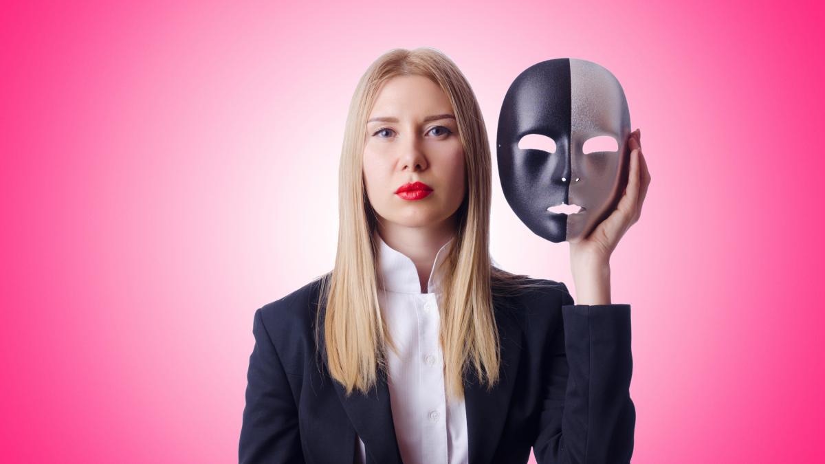 woman-with-mask-hypocrisy-concept_05187600