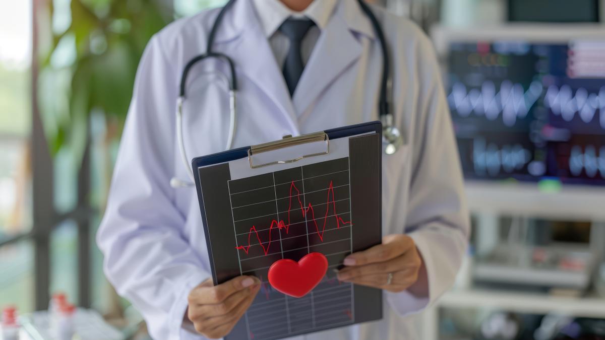 doctor-holding-clipboard-with-illuminated-heartbeat-illustration-hospital-setting_45573000