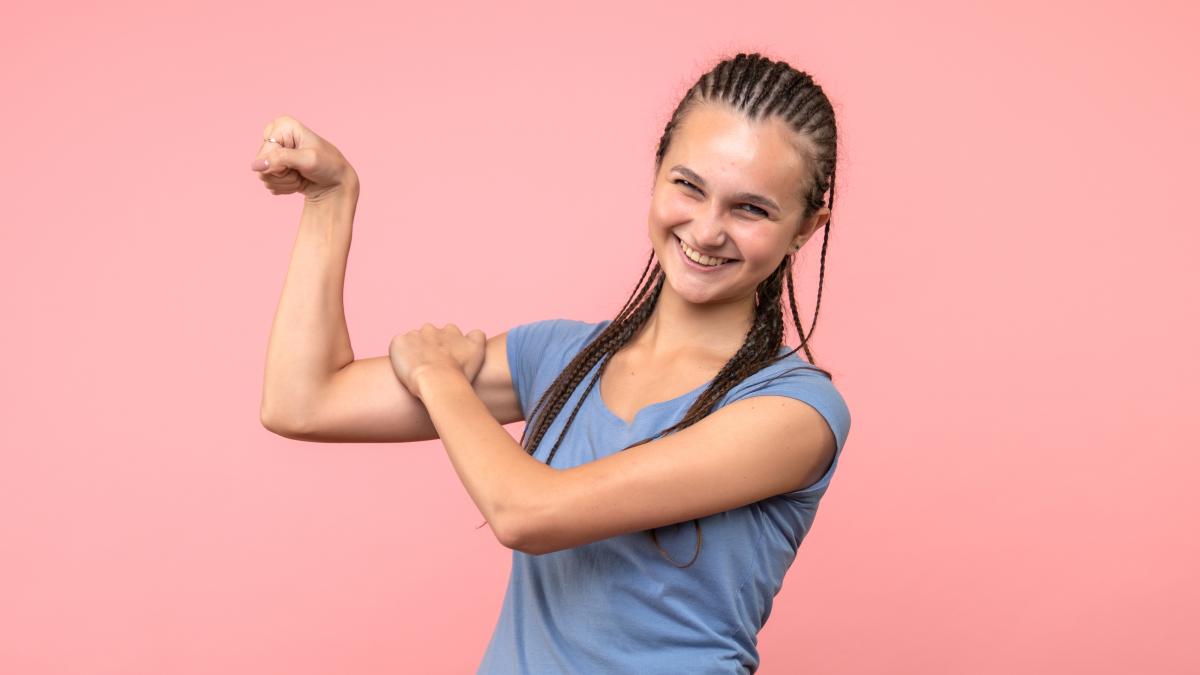 front-view-young-female-smiling-pink_84257700